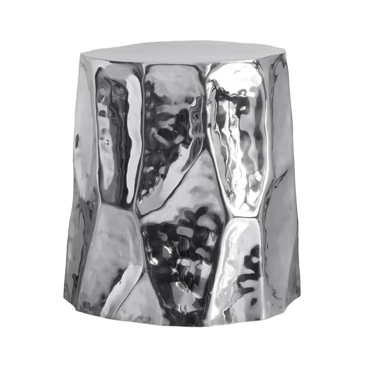 A highly reflective, silver-colored side table with a hammered, irregular geometric pattern on its b… — 3D model