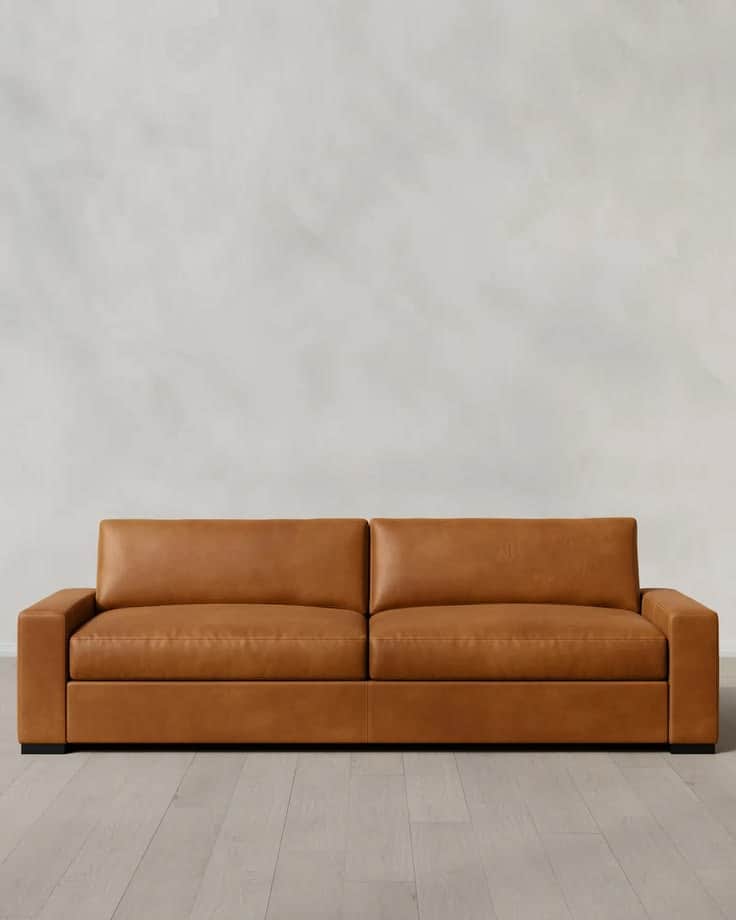 A contemporary sofa upholstered in smooth, tan-colored leather, featuring two wide seat cushions and… — free SKP 3D model