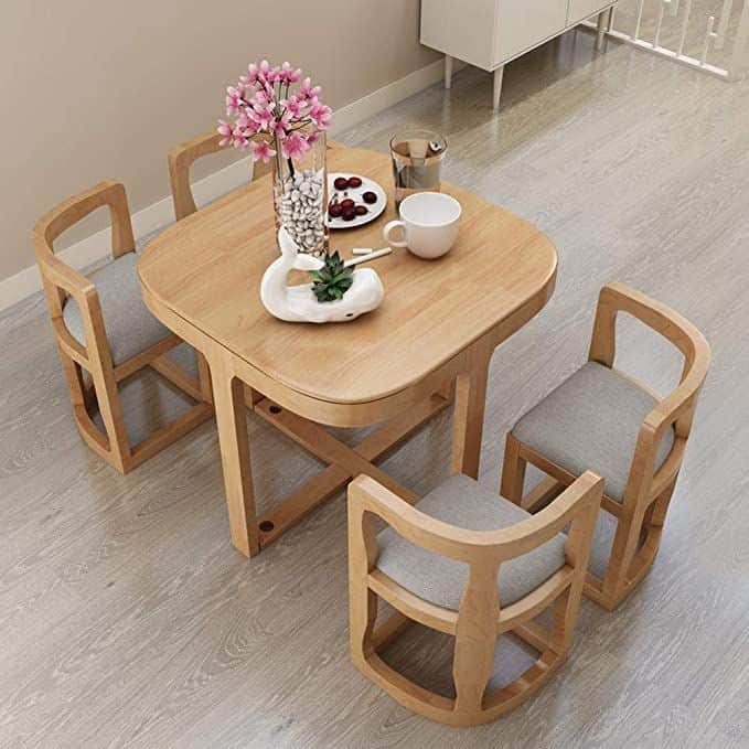 A compact modern dining set featuring a square wooden table with rounded corners and four matching c… — free FBX 3D model