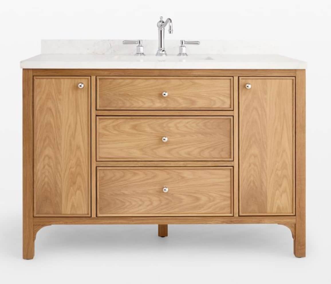 A wooden bathroom vanity with a white countertop and a sink faucet. The vanity features two cabinet… — 3D model