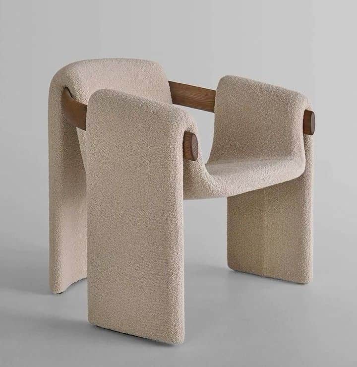A modern lounge chair with a unique sculptural form, featuring continuous draped beige boucle fabric… — free FBX 3D model
