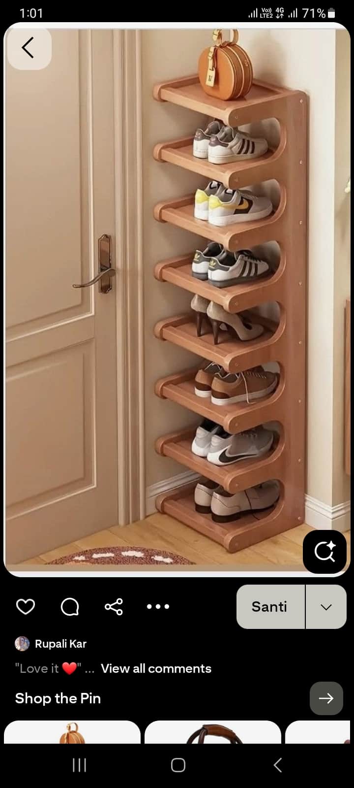 A tall, narrow, multi-tier shelving unit made of light-toned wood, featuring seven slanted shelves d… — 3D model