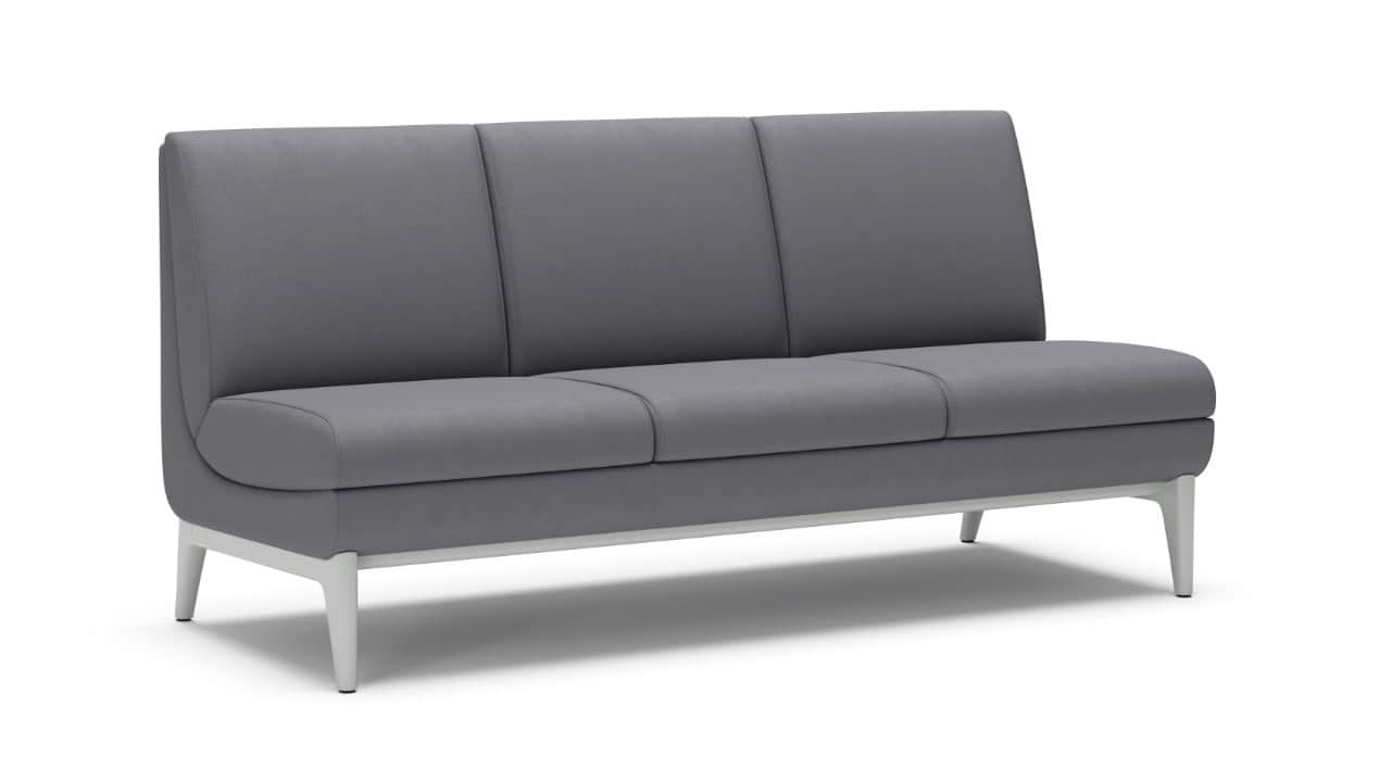 An armless three-seater sofa featuring grey upholstery, distinct segmented back and seat cushions, a… — 3D model