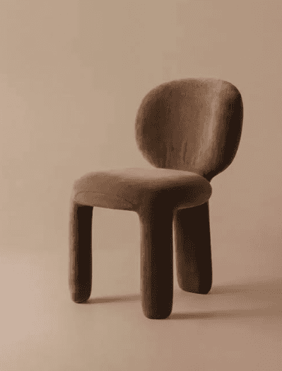 A contemporary lounge chair featuring a fully upholstered, rounded, and organic form. The chair has… — 3D model