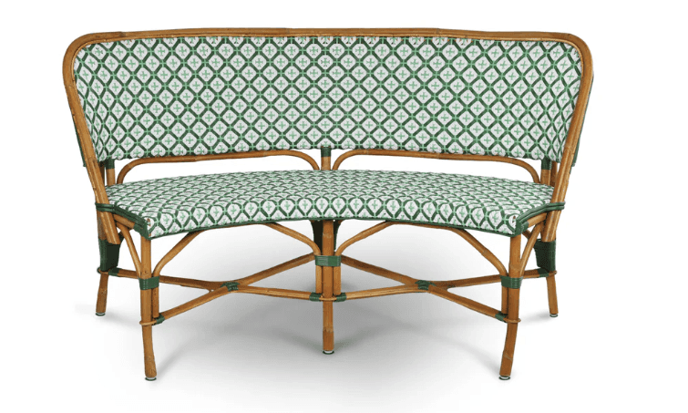 A two-seater bench constructed with a rattan frame. The bench features a curved backrest and seat, b… — 3D model