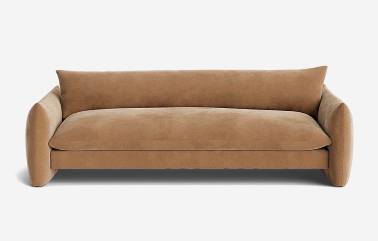 A contemporary, plush sofa with a low profile and rounded arms. The sofa features a single, deep sea… — free GLTF 3D model