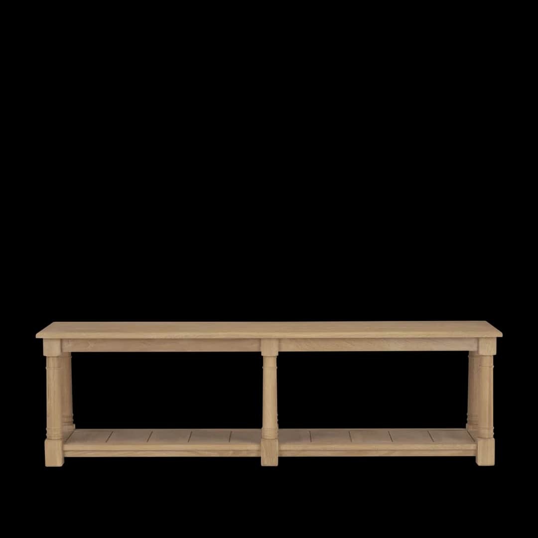 A long, narrow wooden table with a solid top supported by four turned legs. It features a lower shel… — 3D model
