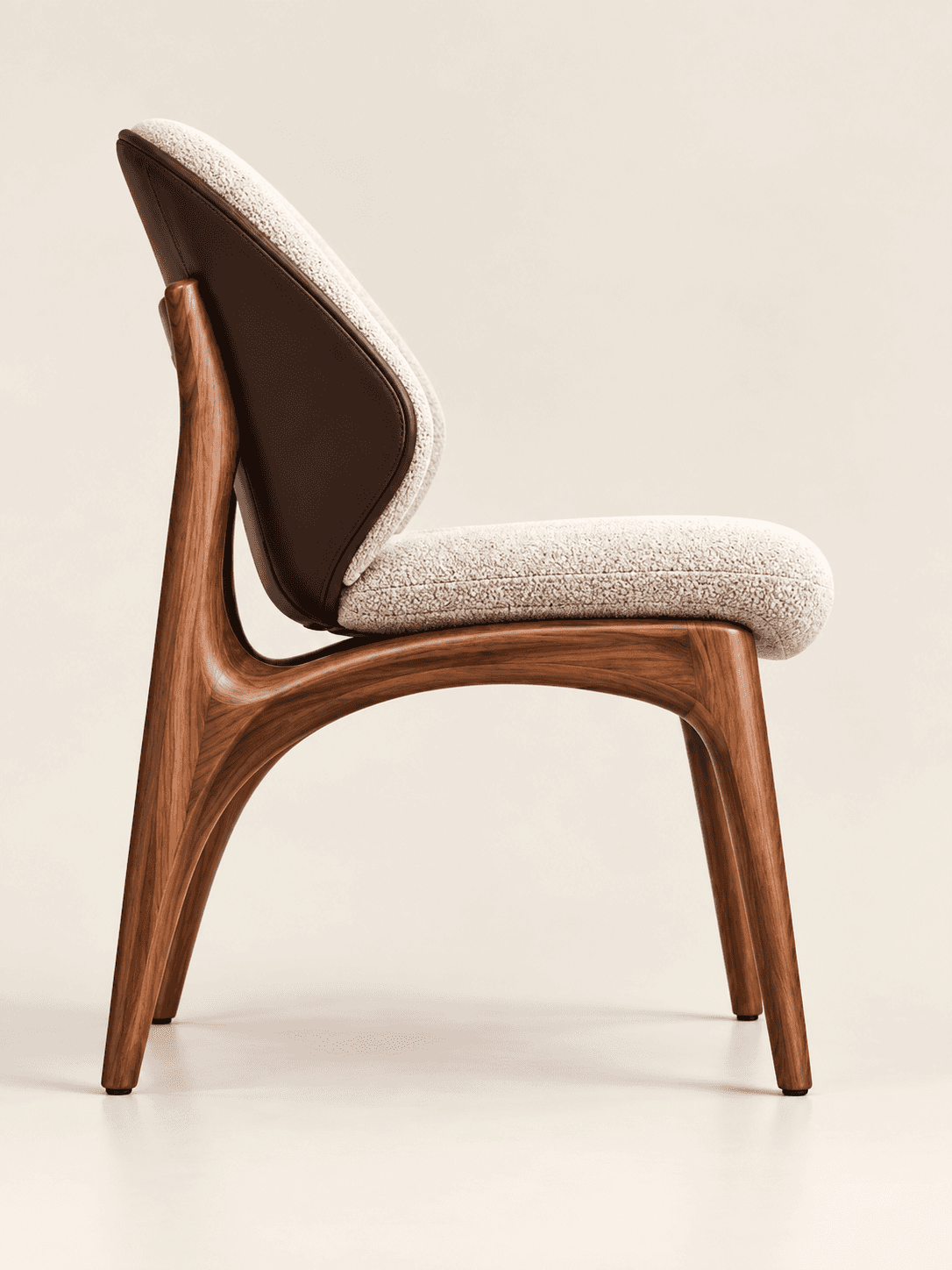 A modern, sculptural chair featuring a dark brown, organically curved walnut wood frame. The seat an… — 3D model