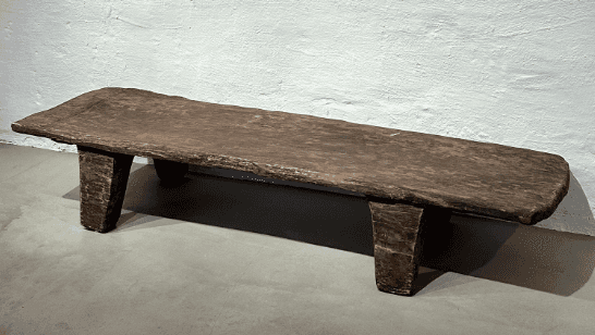 A rustic, low-profile wooden bench with a rectangular seat and four sturdy, block-like legs. The woo… — free SKP 3D model