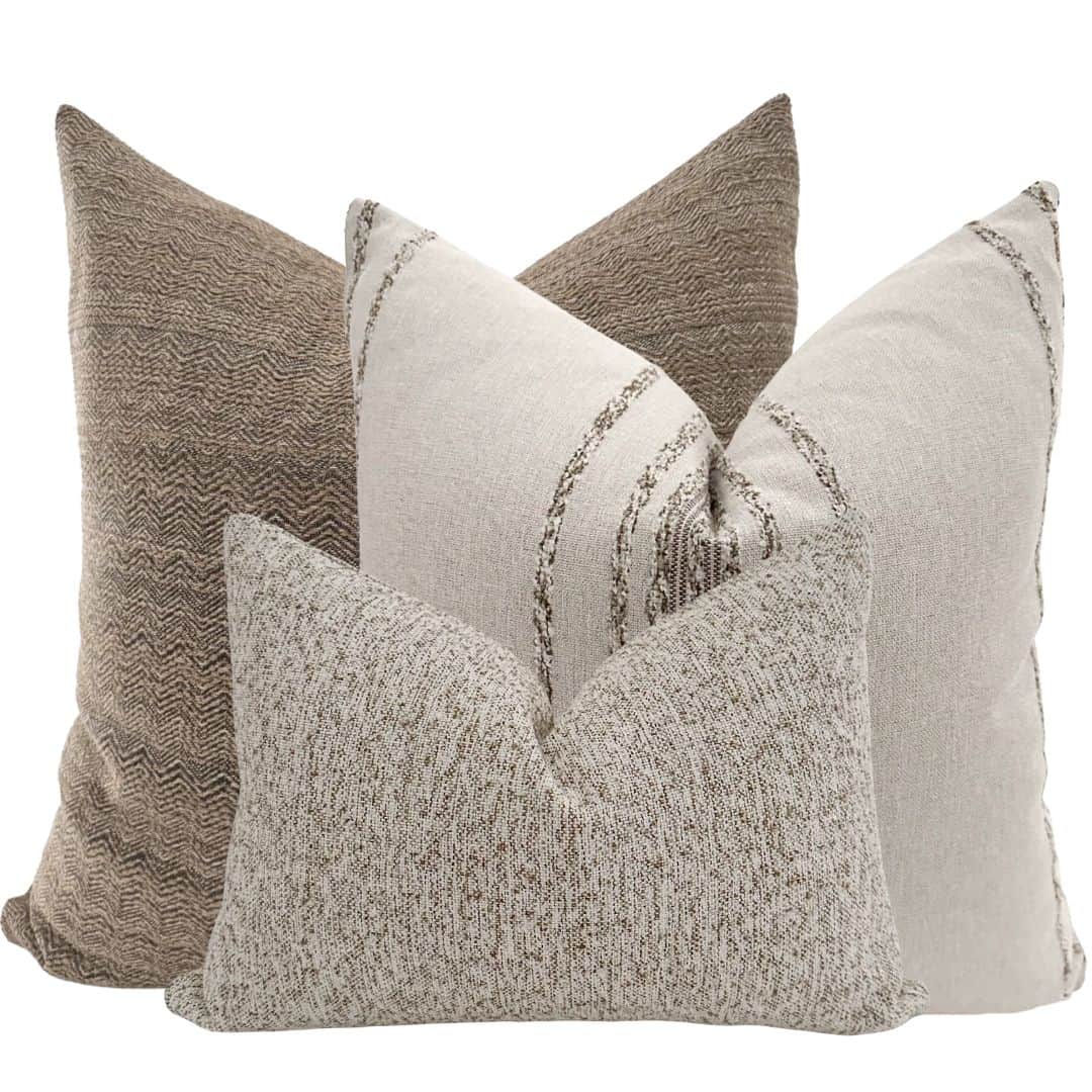 A textured pillow with a speckled pattern, featuring a neutral color palette. It is designed with a… — 3D model