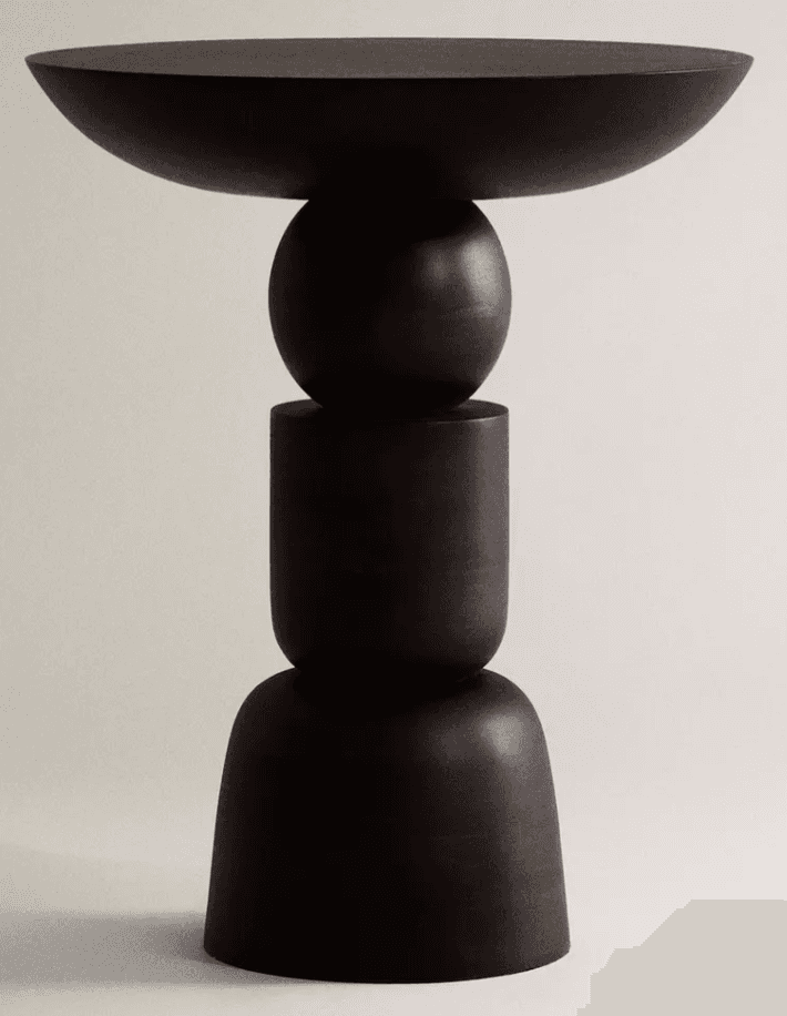 A tall, sculptural pedestal table constructed from dark-stained wood, featuring a base composed of s… — 3D model