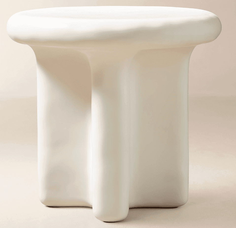 A sculptural white accent table featuring a rounded, slightly recessed top and three broad, organica… — 3D model