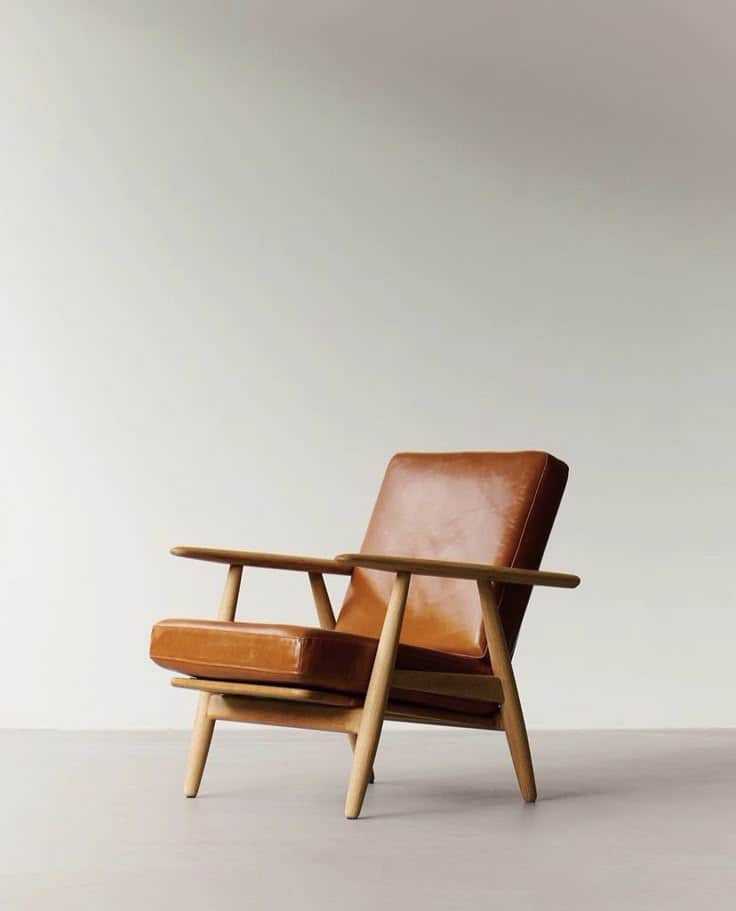 A modern lounge chair featuring a sturdy light-toned wooden frame with visible joinery and comfortab… — free FBX 3D model
