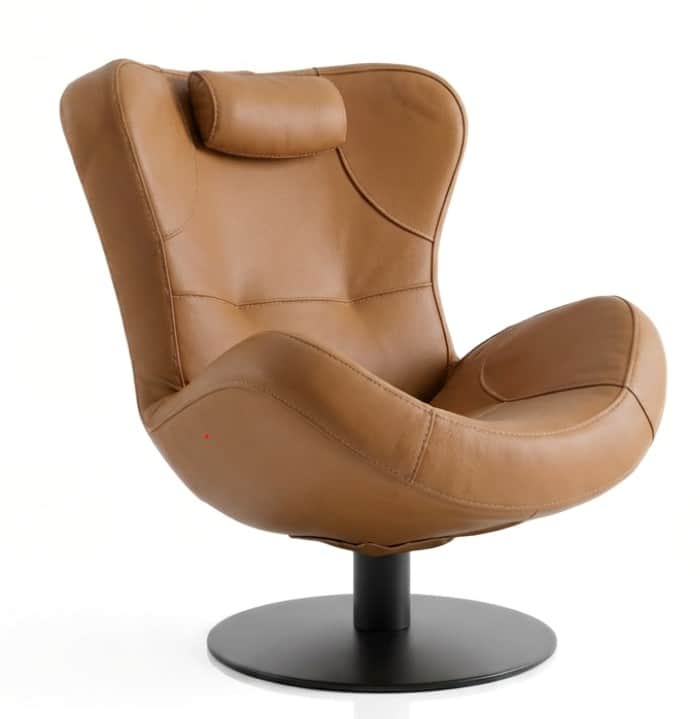 A contemporary tan leather lounge chair featuring a distinctive curved, high-back design, an integra… — 3D model