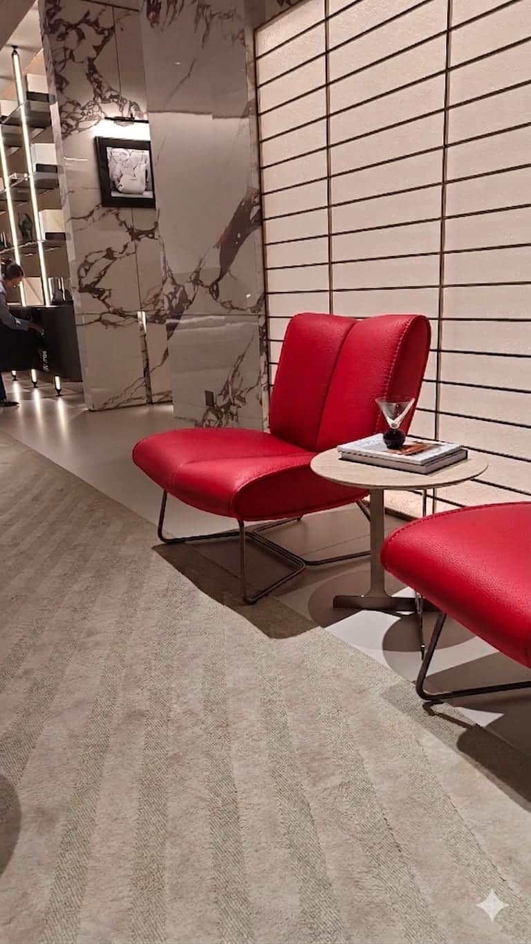 A modern armchair with a low profile and a unique geometric metal base. The seat and backrest are up… — 3D model