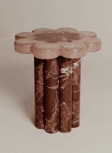 A side table with a top shaped like a flower, featuring multiple rounded petals. The top appears to… — 3D model