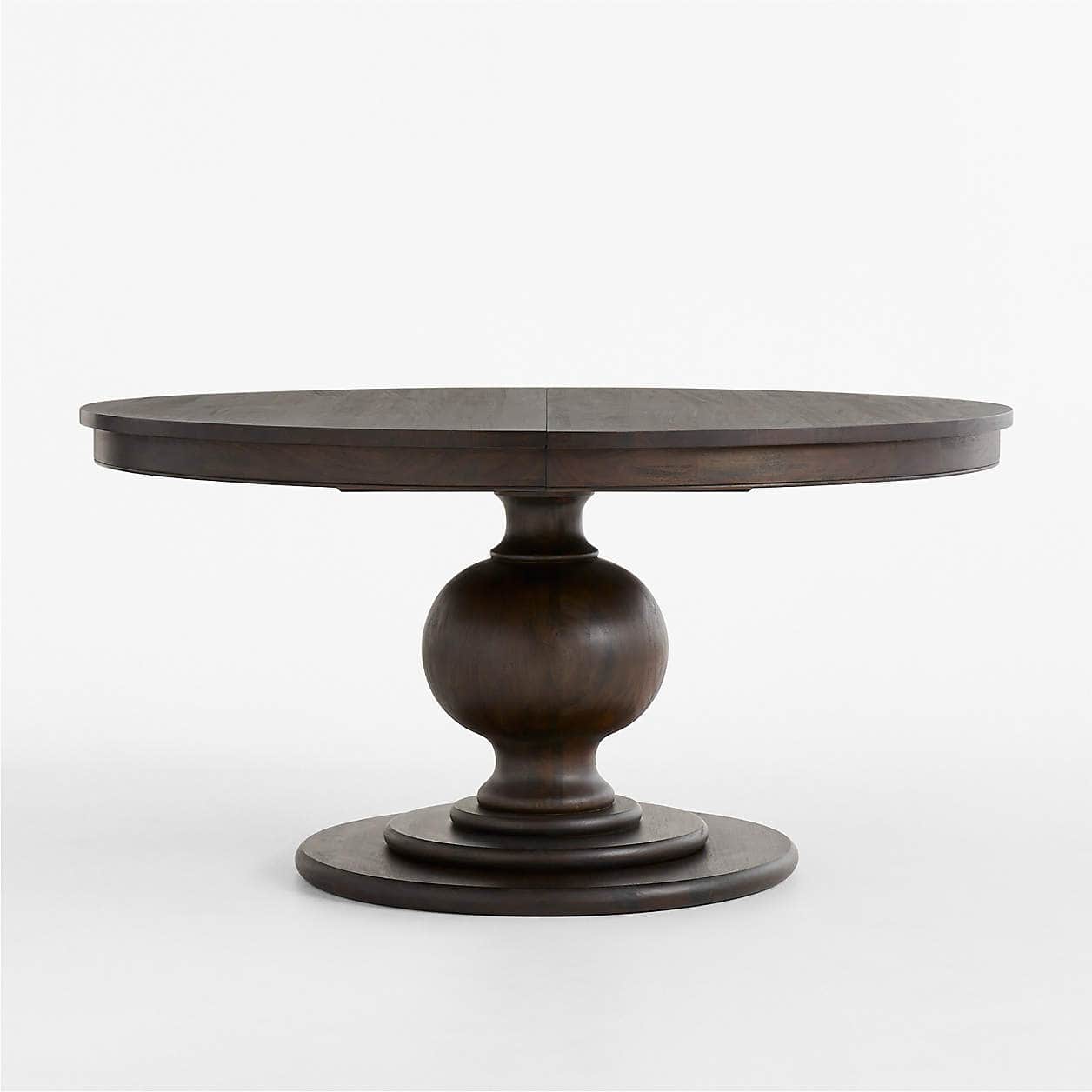 A round dining table constructed from dark-stained wood, featuring a prominent turned pedestal base… — free OBJ 3D model