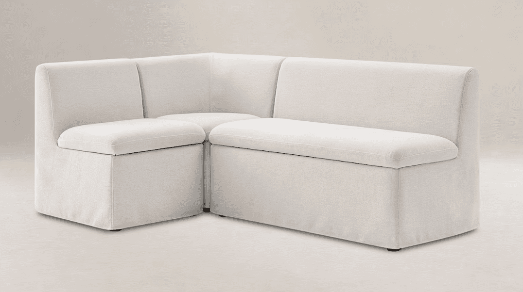 An L-shaped upholstered corner seating unit, consisting of multiple modules, featuring a light-color… — 3D model