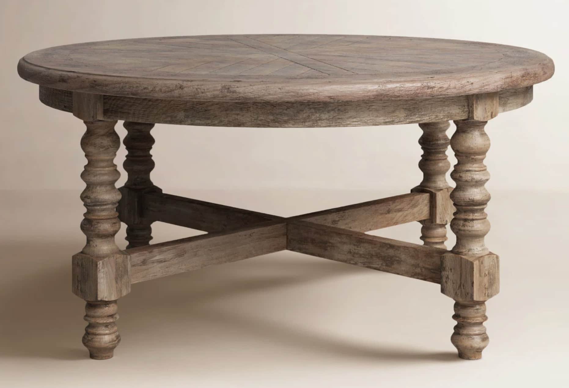 A rustic, round dining table with a weathered wood finish. The tabletop features a geometric pattern… — free OBJ 3D model