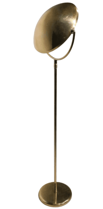 A tall, slender floor lamp constructed entirely from brass, featuring a circular base, a straight st… — 3D model