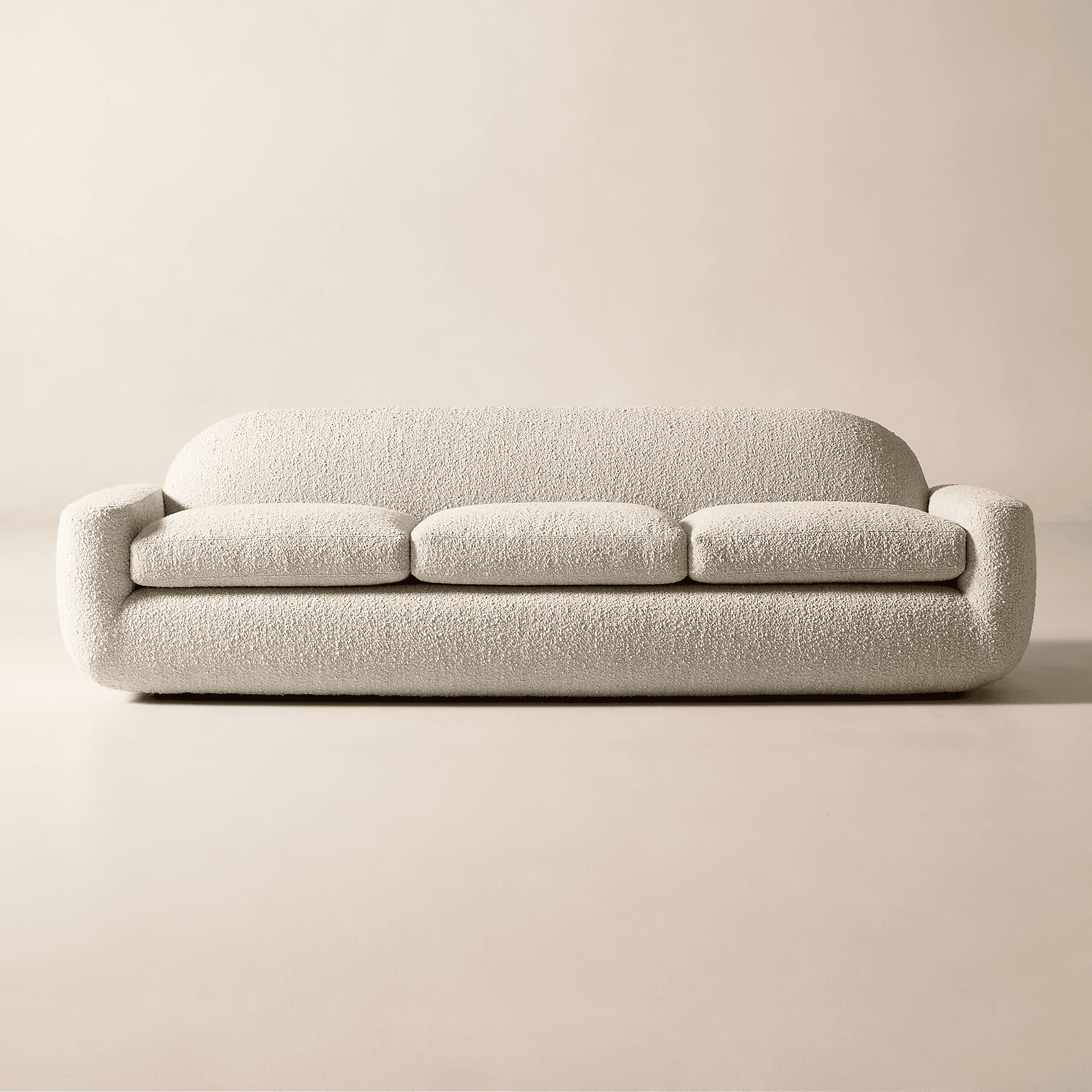 A contemporary three-seater sofa upholstered in an off-white bouclé fabric, featuring a distinctly r… — free GLTF 3D model