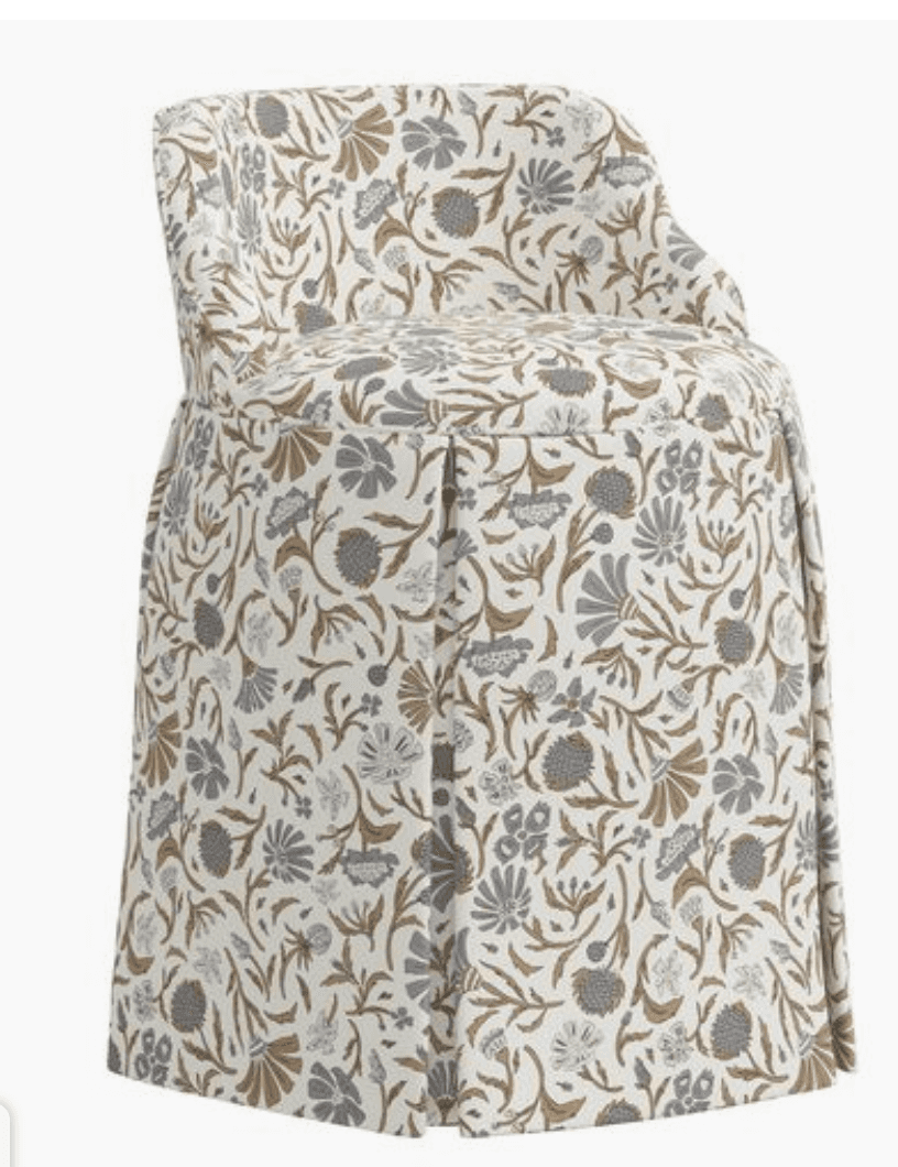 An upholstered accent chair with a skirted base and a rounded back. The chair is covered in a fabric… — free OBJ 3D model