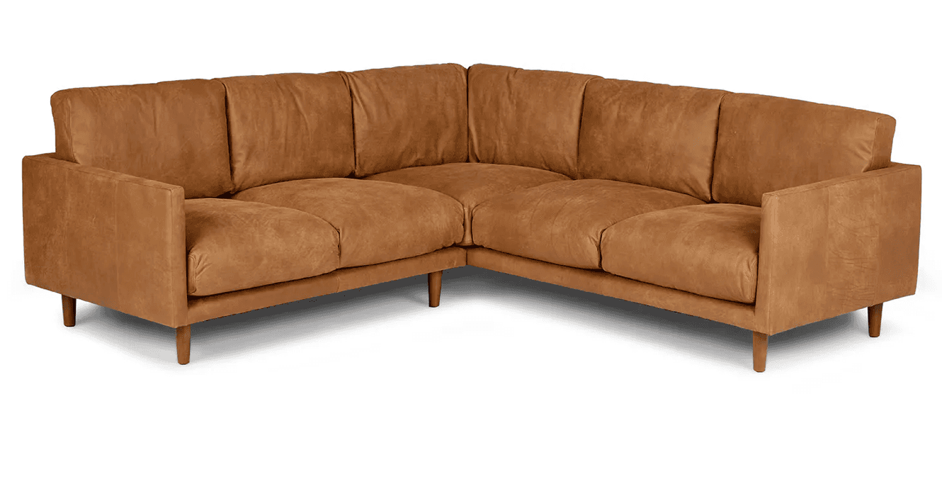 An L-shaped sectional sofa upholstered in a tan or camel-colored distressed leather, featuring clean… — 3D model
