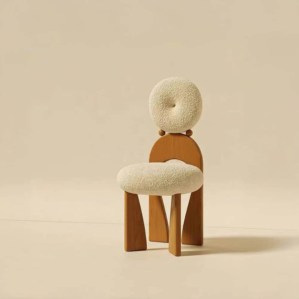A contemporary accent chair featuring a light-toned wooden frame and cream-colored bouclé upholstery… — 3D model