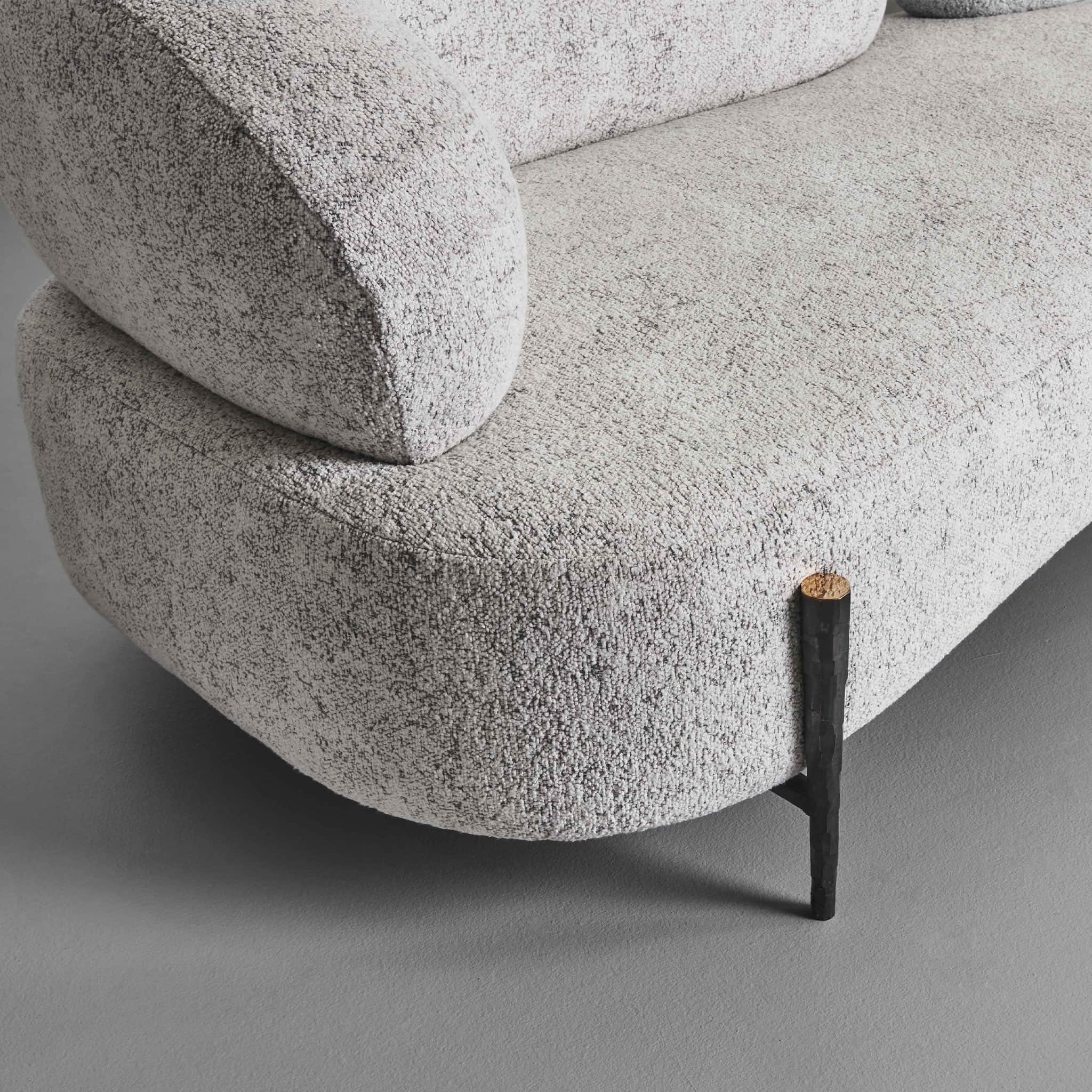 A close-up view of a segment of a modern sofa, featuring rounded, organic lines and textured upholst… — free FBX 3D model