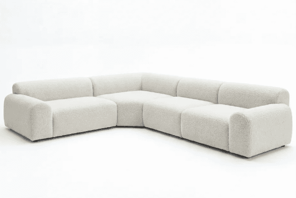 An L-shaped modular sectional sofa upholstered in a light, textured bouclé fabric, featuring rounded… — 3D model