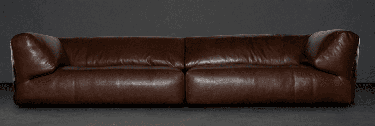 A contemporary two-seater sofa upholstered in brown leather. The sofa features a low profile with ge… — free FBX 3D model