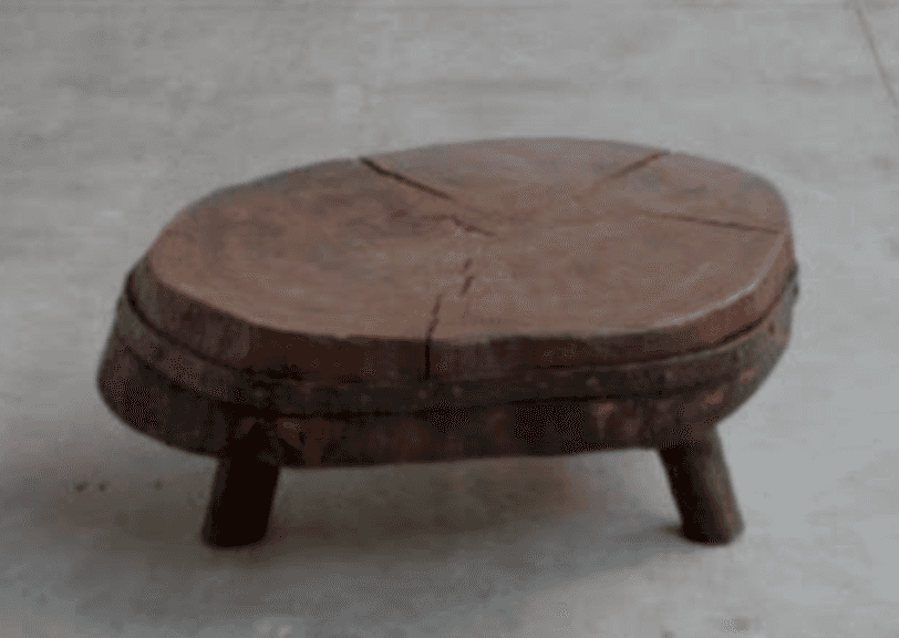 A rustic and primitive low table, likely serving as a coffee table or accent table, crafted from a t… — 3D model