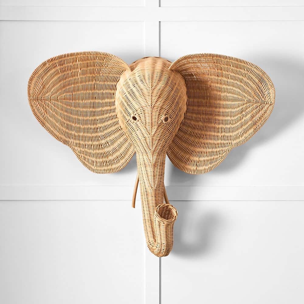 A natural-toned decorative wall sculpture in the shape of an elephant's head, intricately woven from… — 3D model