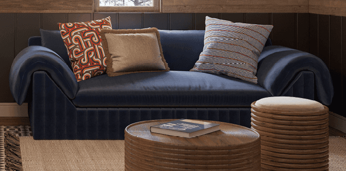 A modern loveseat with deep navy blue upholstery, featuring a distinctive vertically fluted base and… — 3D model