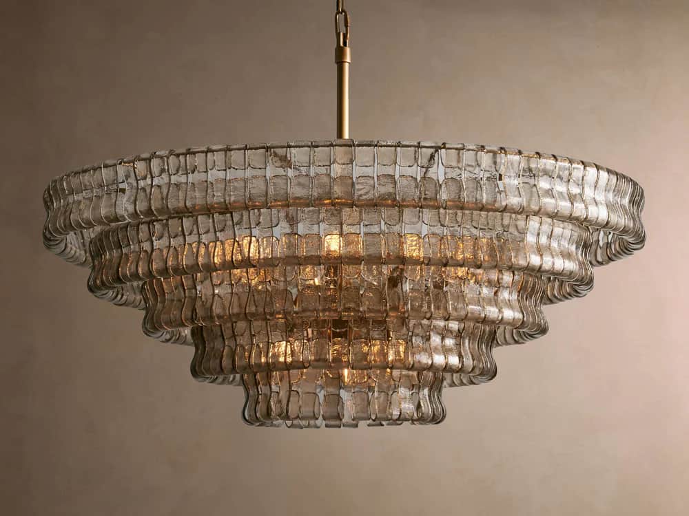 A multi-tiered chandelier with a tiered, cascading design. The fixture features numerous individual… — 3D model