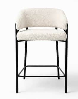 A contemporary bar stool featuring a sturdy black metal frame and cream-colored boucle fabric uphols… — 3D model