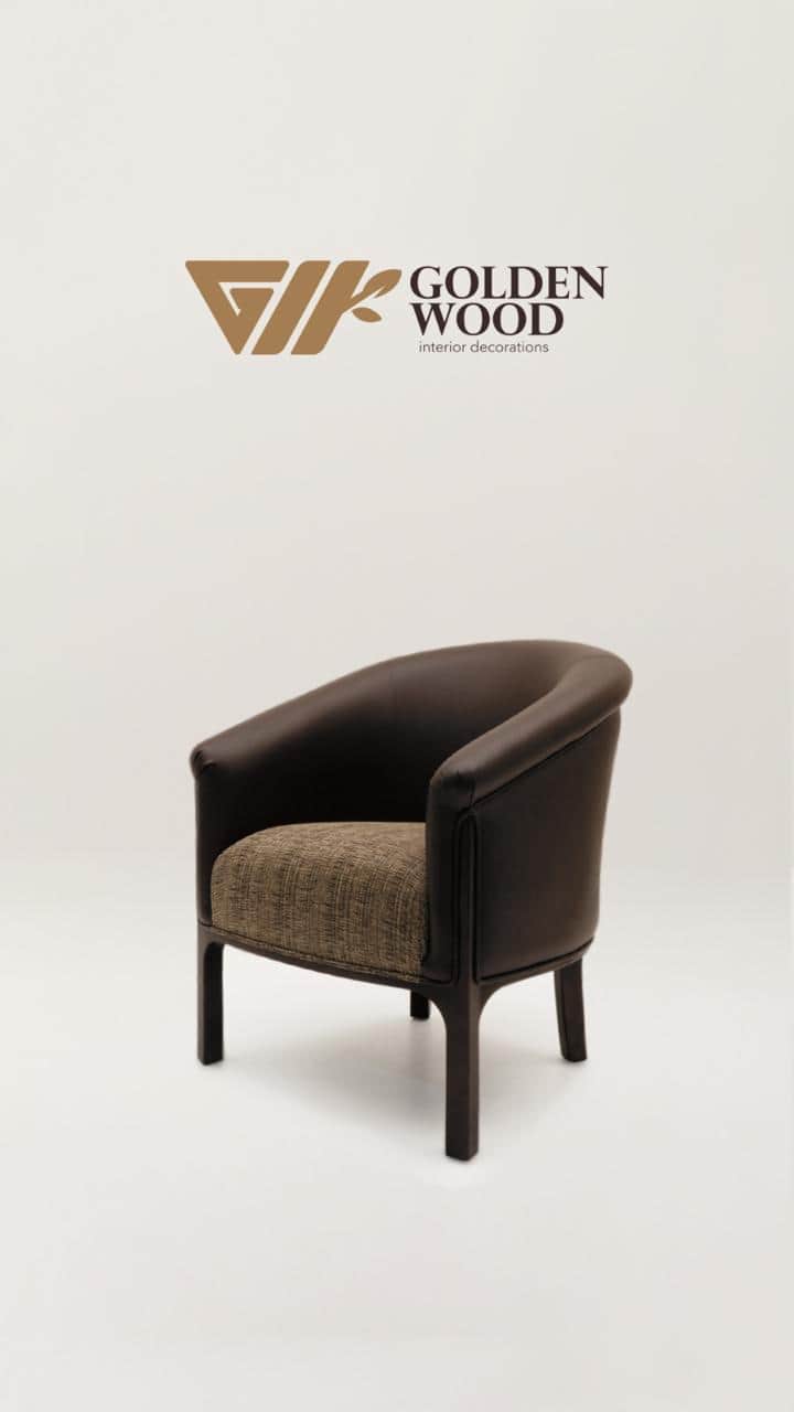 A modern tub armchair featuring a continuous, rounded back and armrest upholstered in dark brown, wi… — 3D model