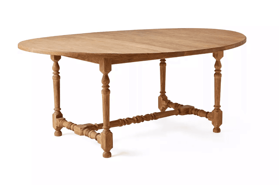 A traditional style oval dining table constructed from light-colored solid wood. It features an oval… — 3D model