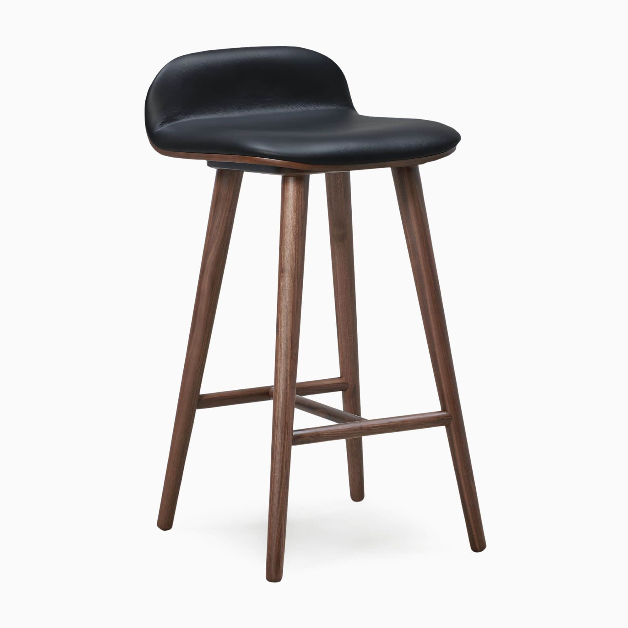 A modern bar stool featuring a black upholstered seat and backrest, supported by a splayed dark waln… — 3D model