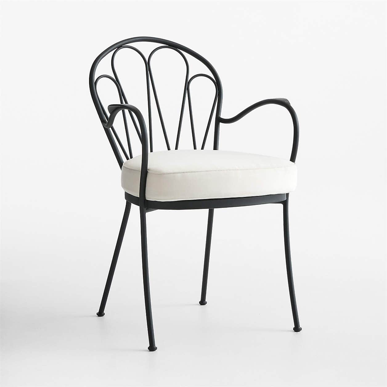 A black metal armchair with a curved backrest featuring a fan-like design formed by vertical metal r… — free OBJ 3D model