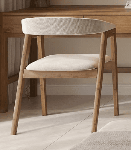 A contemporary armchair featuring a light-toned wooden frame and cream-colored upholstered seat and… — 3D model