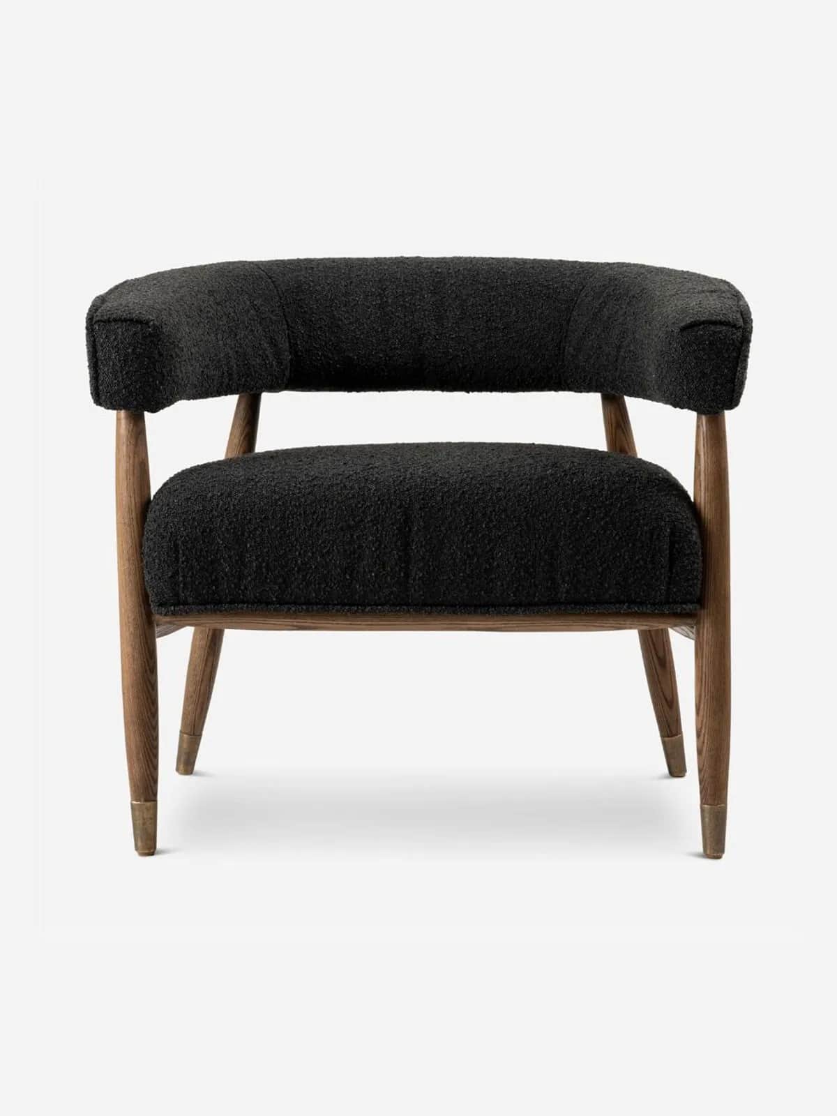 A modern upholstered accent armchair featuring a black bouclé fabric, a solid wooden frame, and tape… — 3D model