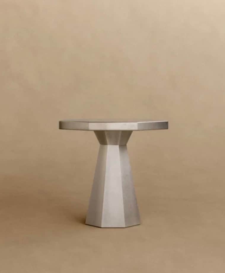 A contemporary octagonal table with a faceted pedestal base, rendered in a uniform grey finish, like… — free STL 3D model
