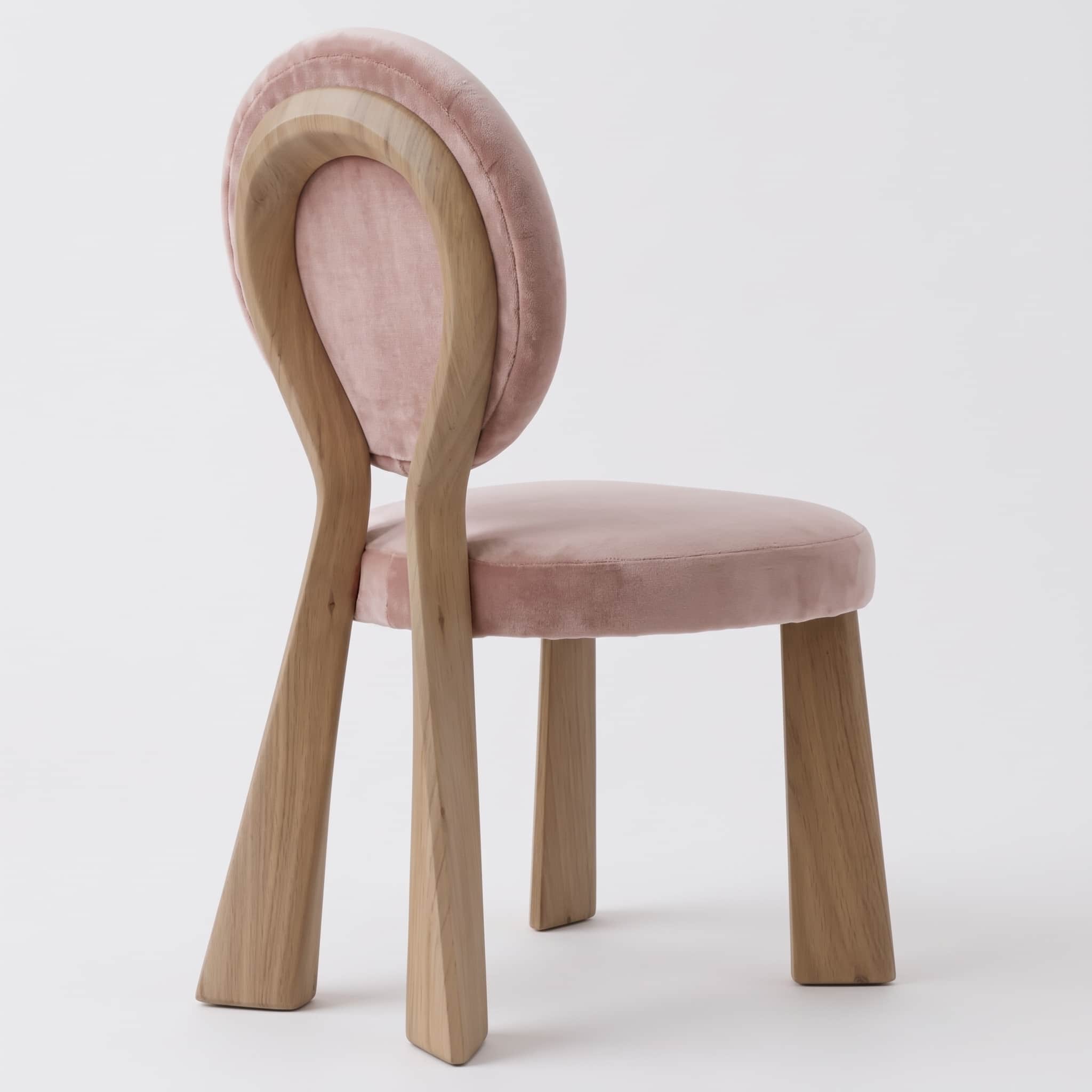 A contemporary chair featuring a unique sculptural backrest crafted from light-toned wood, complemen… — 3D model