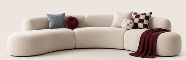 A large, modern modular sectional sofa with a curved form, upholstered in a light, textured boucle f… — 3D model