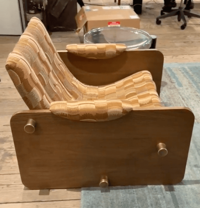 A mid-century modern style lounge chair featuring a sturdy wooden frame and a comfortable, curved up… — 3D model