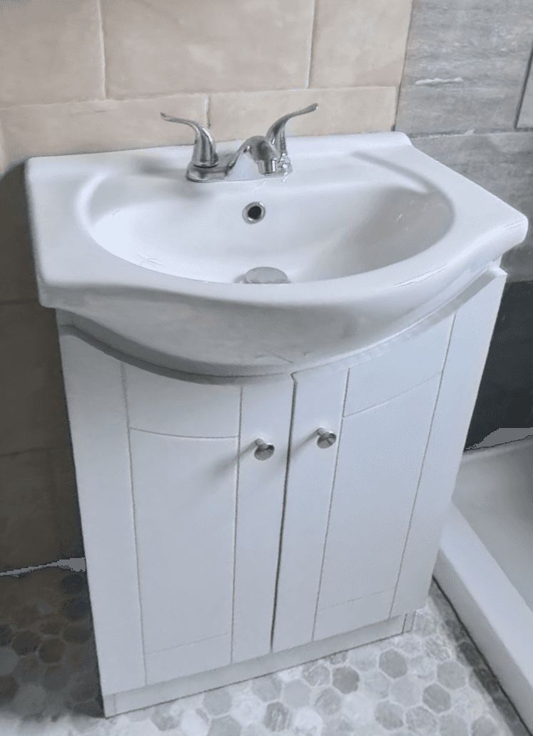 A freestanding bathroom vanity unit featuring a white ceramic basin integrated into a white cabinet… — 3D model