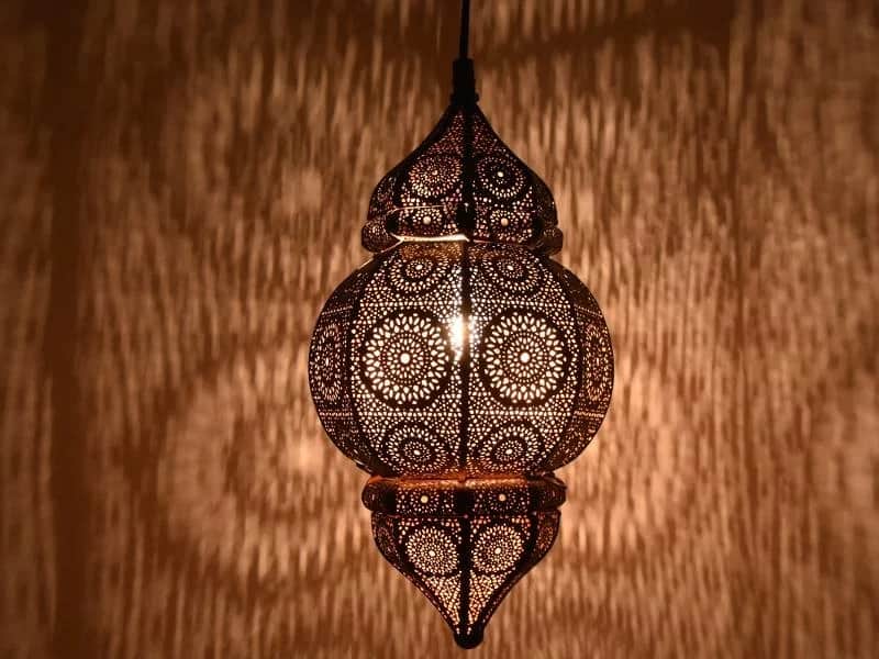 A highly decorative Moroccan-style pendant lantern, crafted from bronze-toned metal with intricate f… — 3D model
