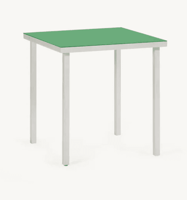 A square side table with a green top and four slender, white legs. The legs are angled inwards sligh… — 3D model