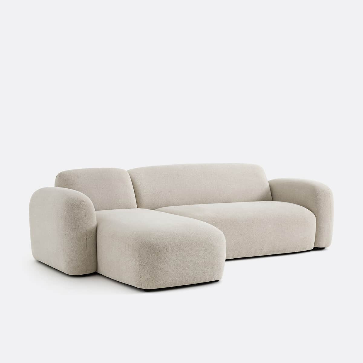 A contemporary sectional sofa featuring a right-hand facing chaise lounge, upholstered in a light be… — 3D model